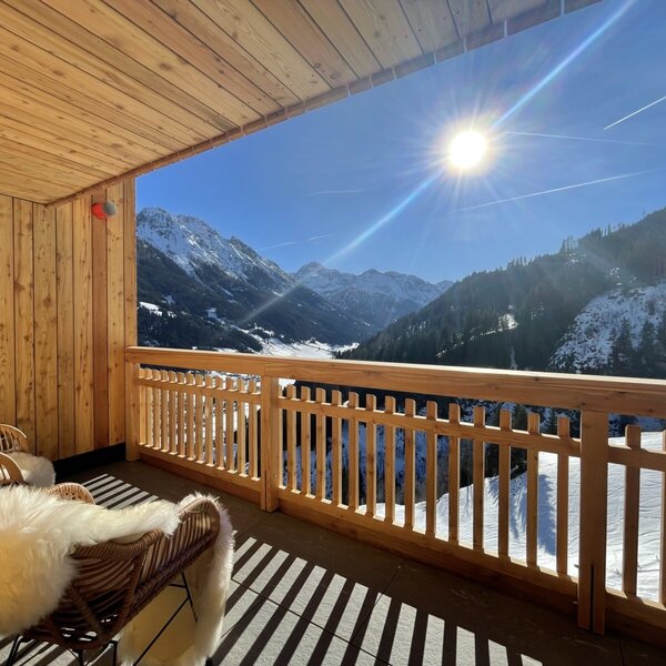 Balcony of a holiday flat at the Farm House, with seating and a sunny view of the snow-covered mountains. Balcony of a holiday flat at the Farm House, with seating and a sunny view of the snow-covered mountains.